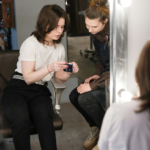 Client discussing hairstyle ideas with her stylist during a consultation.